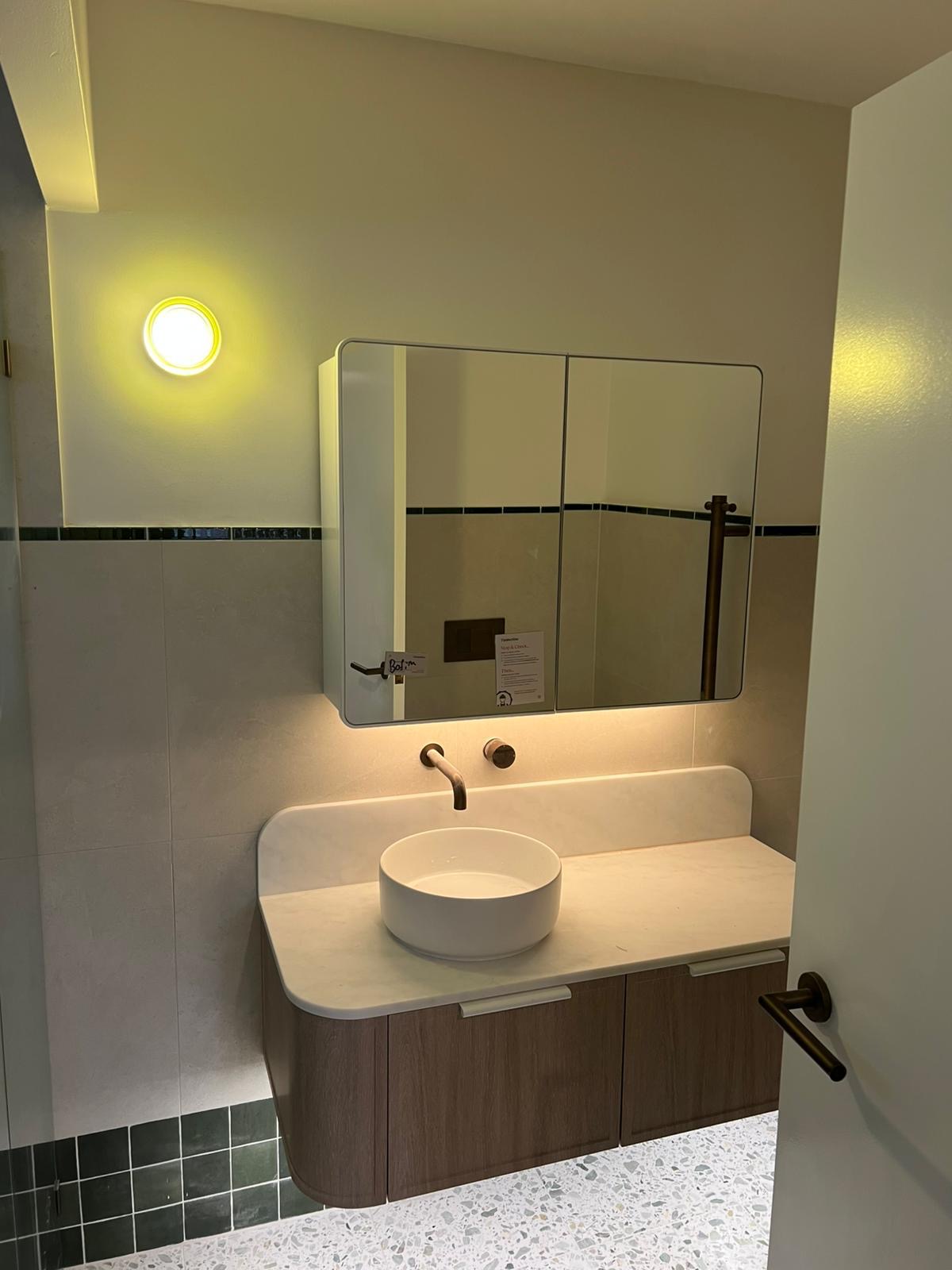 Vanity with under mirror LED lighting and wall light